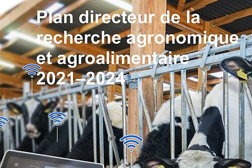 Page de couverture avec des vaches en train de manger dans un étable et un ordinateur portable